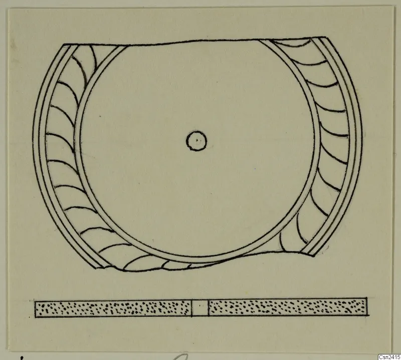 Drawing of a round object with an arc-patterned outer band, with a scale bar below