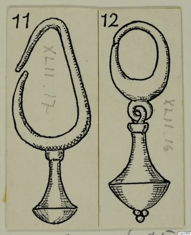 Drawing of two silver objects: one teardrop-shaped with an open loop, one with an oval loop and a bell-shaped base