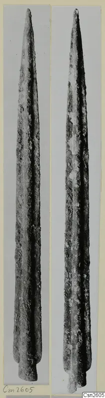 Two views of a long, pointed metal blade with a rough, corroded surface