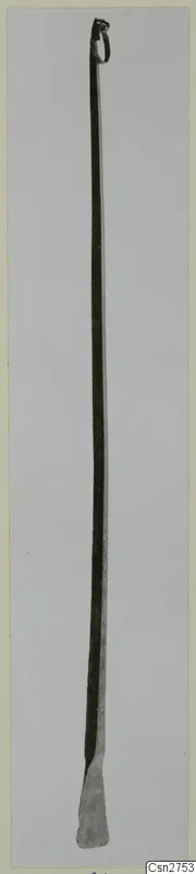 Long bronze tool with a loop at the top and a flattened, splayed blade at the bottom