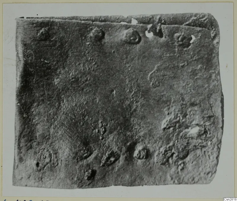 Corroded bronze object from Lapithos, Kastros tombs, close view of its pitted, crusted surface