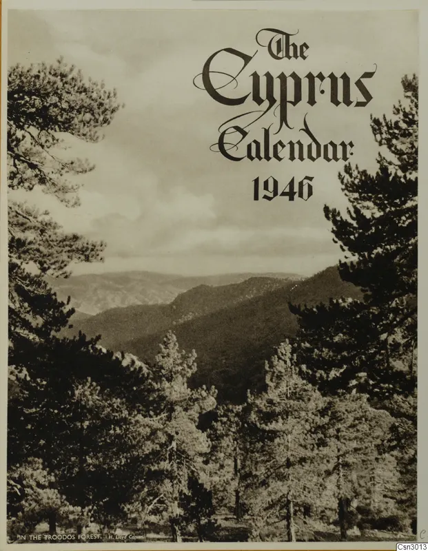 Printed calendar cover with a photograph of pine trees in the foreground and wooded mountains beyond, Troodos