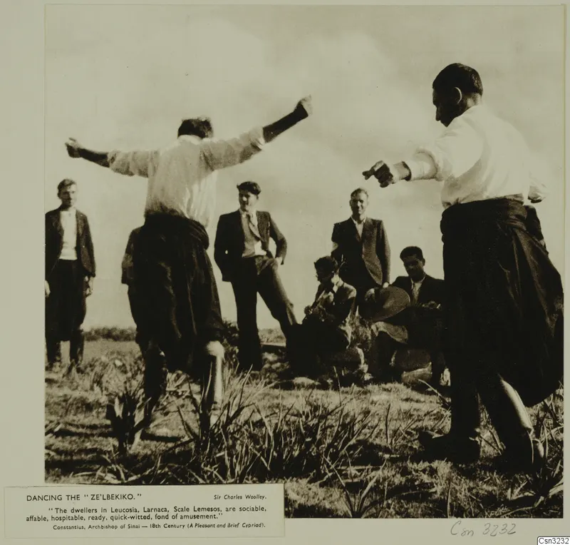 Men dancing in a grassy field while others watch, shown as a photograph mounted on a printed page with a caption.