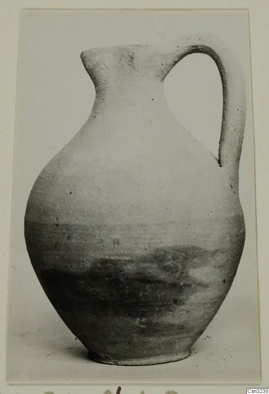 Pottery Plain White VI, a jug with a single loop handle, photographed on a card mount