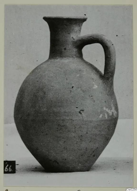 Pottery jug with a single loop handle and flared rim, from the Kastros tombs at Lapithos