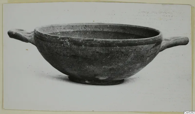 Pottery bowl with two short horizontal handles and a low ring foot, shown in profile