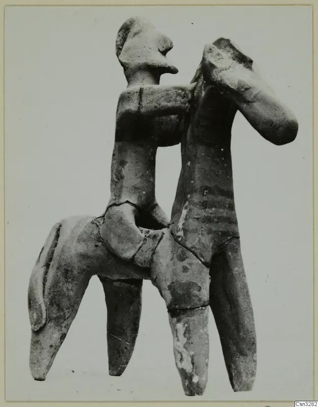 Terracotta figurine of a human figure seated on the back of a four-legged animal, from Ayia Irini