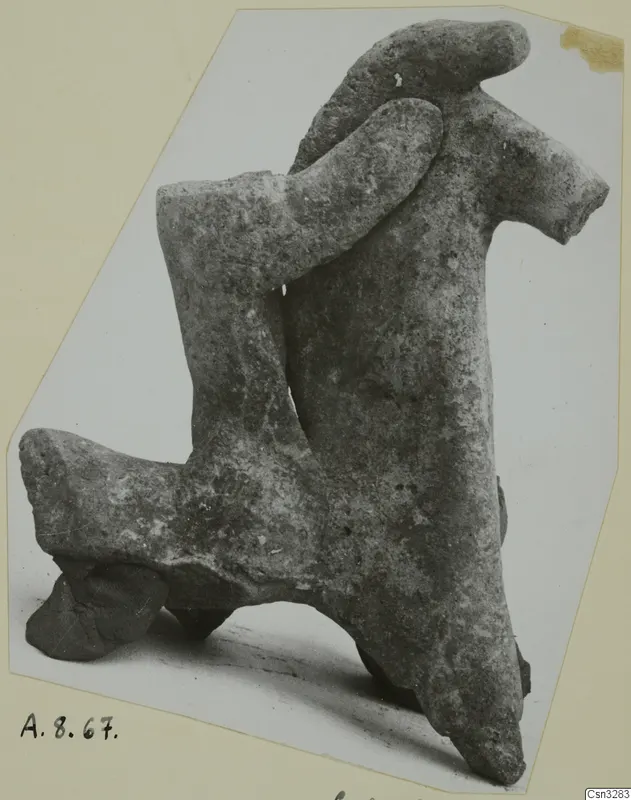 Terracotta figurine of an animal with raised head and projecting legs, shown in side view