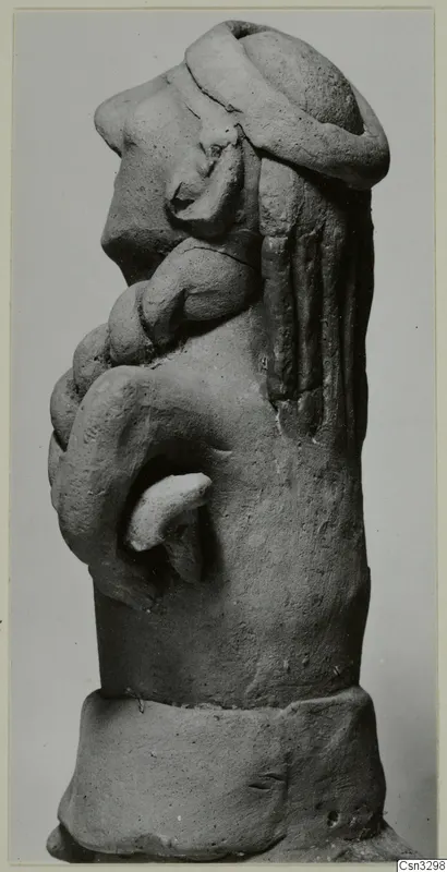 Terracotta figure in side view, with a rounded head, bent arm and thick ring-shaped base.