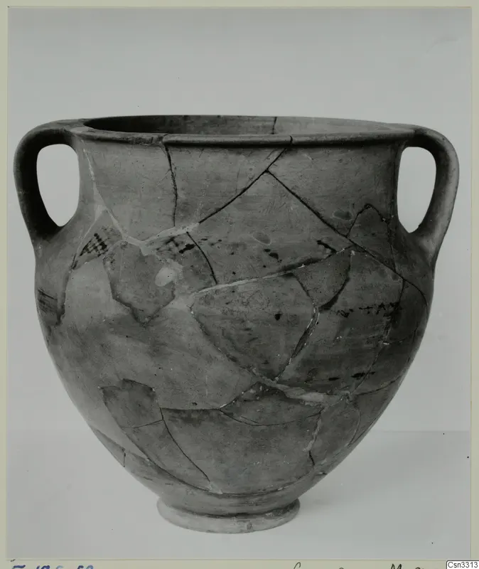 Two-handled amphora-crater from Enkomi, reconstructed from fragments and shown against a plain grey backdrop