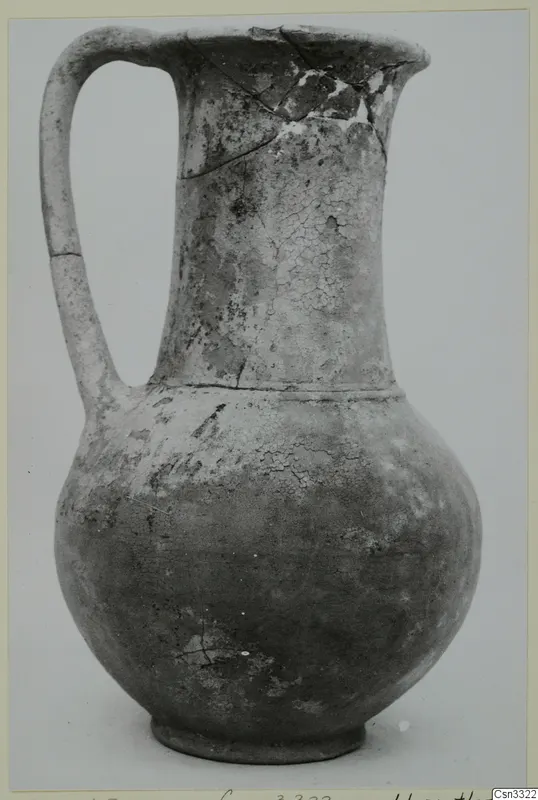 Pottery jug with a tall neck, single loop handle and rounded body, from Milia