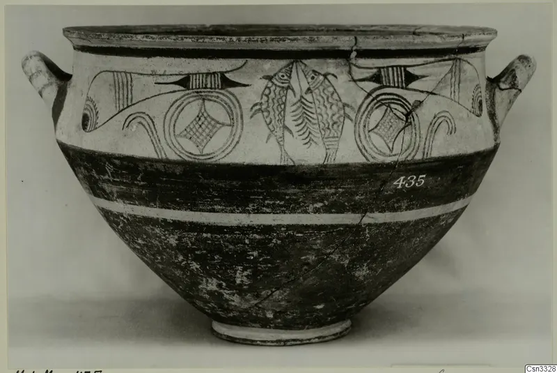 White Painted pottery bowl with two handles, painted fish and circle motifs in dark paint on a pale upper band