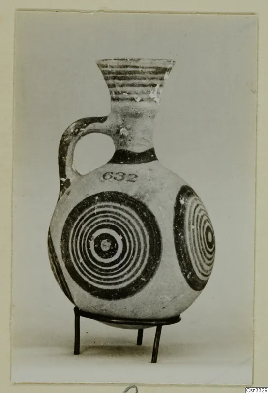 Pottery White Painted IV: a one-handled jug with concentric circles painted on its body
