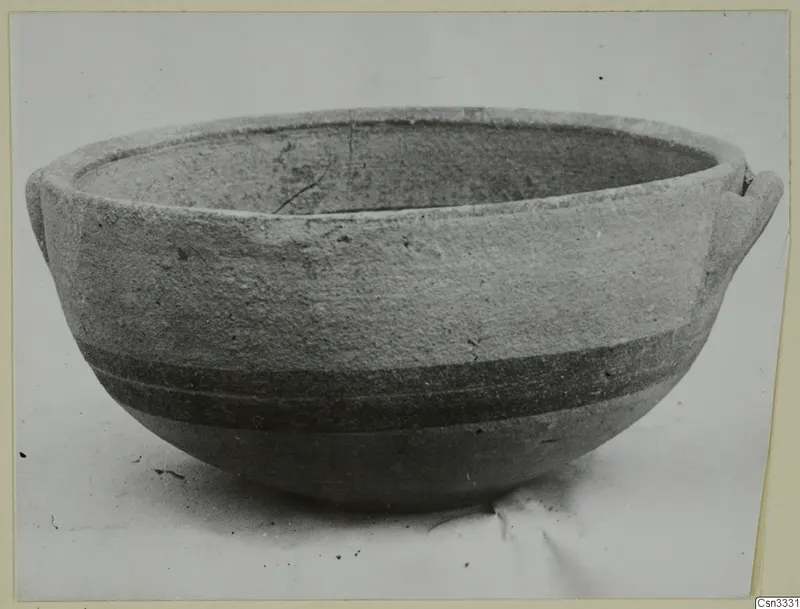 Pottery bowl, White Painted IV, from Amathus, photographed on a plain surface