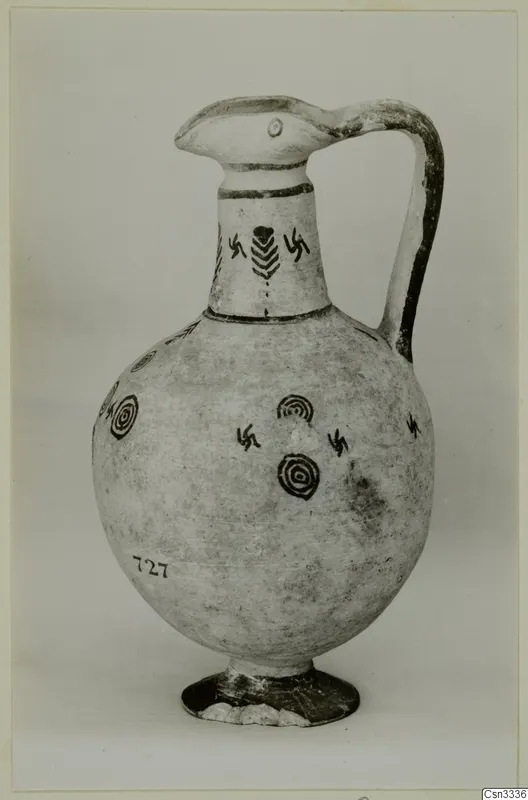 Pottery White Painted IV: a jug with a beak-like spout, strap handle and dark painted circles and hooked crosses