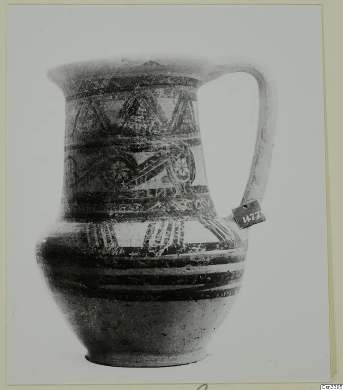 Bichrome wheel-made pottery jug with a single handle and painted bands