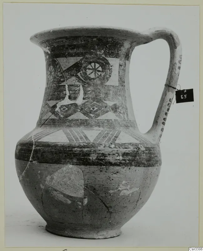 Bichrome wheel-made jug from Heurltey with painted triangles, diamonds and a rosette motif