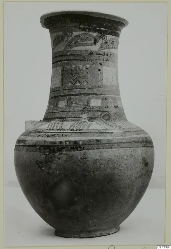 Tall wheel-made pottery jar with painted bands and motifs on its neck and shoulder