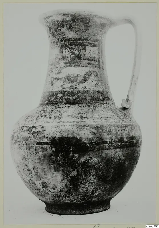 Bichrome wheel-made jug with a single strap handle and painted bands on the neck and shoulder