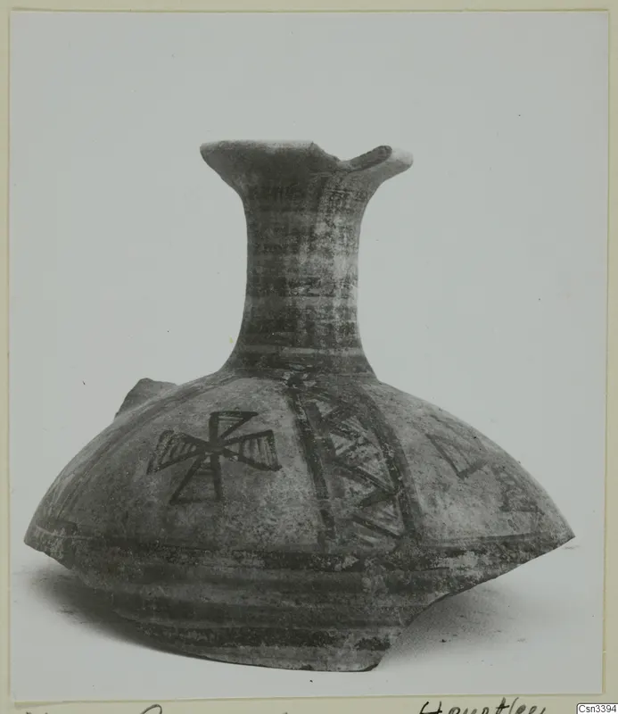Painted pottery vessel with a tall flaring neck and dark geometric bands