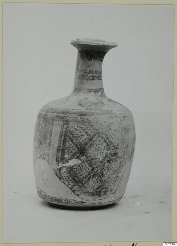 Bichrome wheel-made pottery vessel with a long neck, painted dark bands and lattice patterns on the body