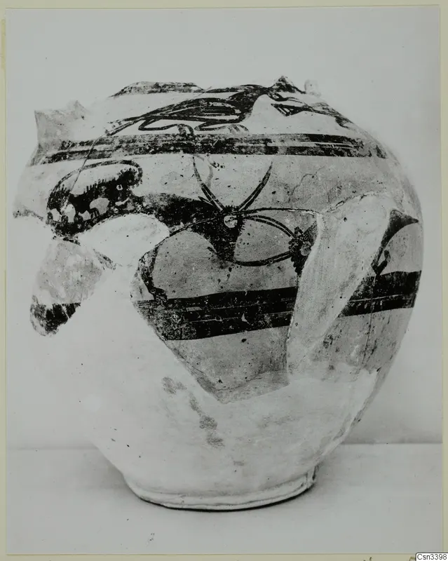Pottery Bichrome Wheel-made vessel with black painted bands and a large curving motif