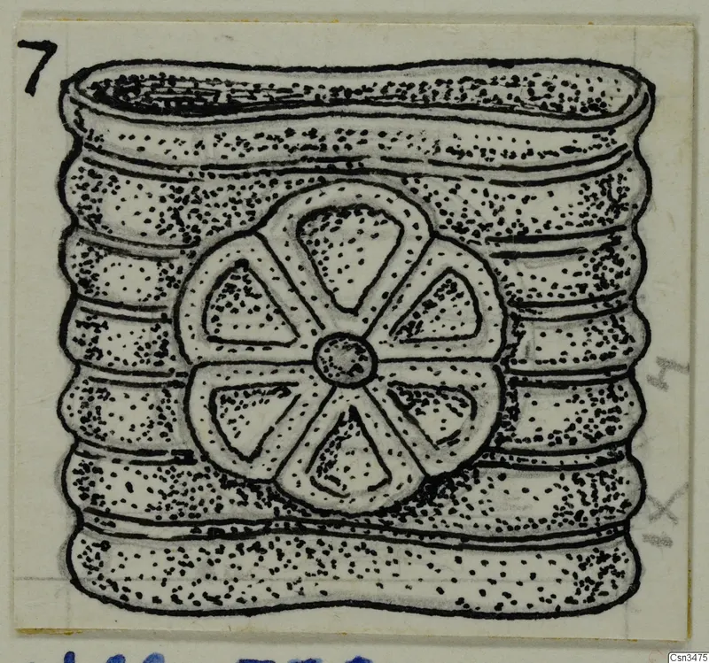 Ink drawing of a ridged, barrel-shaped object with a six-spoked rosette on its side.