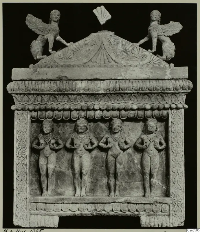 Limestone sarcophagus from Cyprus with four standing relief figures and winged figures on its pediment