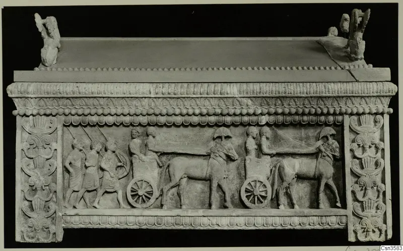 Sarcophagus front carved in relief with walking figures, a two-wheeled cart and two animals in harness.