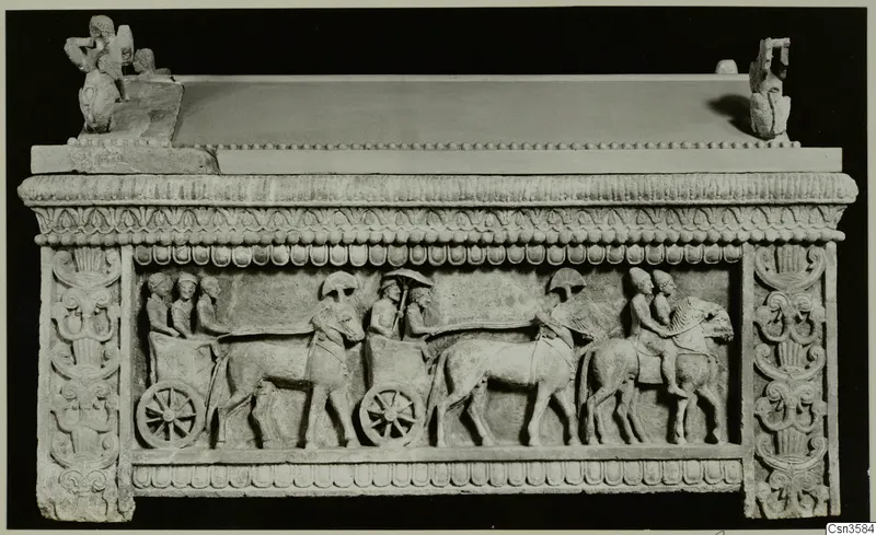 Stone sarcophagus with a relief frieze of chariots and horsemen