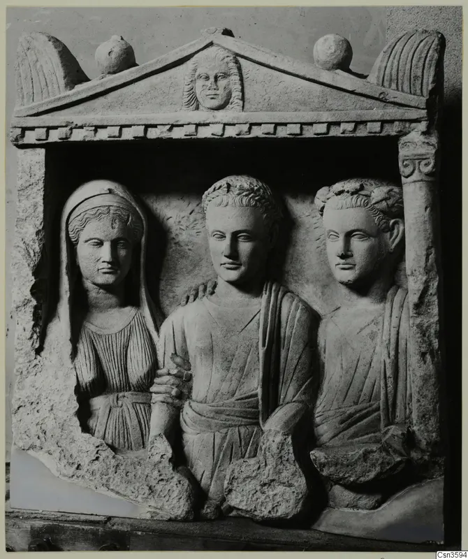 Carved stone relief of three figures in a pedimented niche, a veiled woman on the left.
