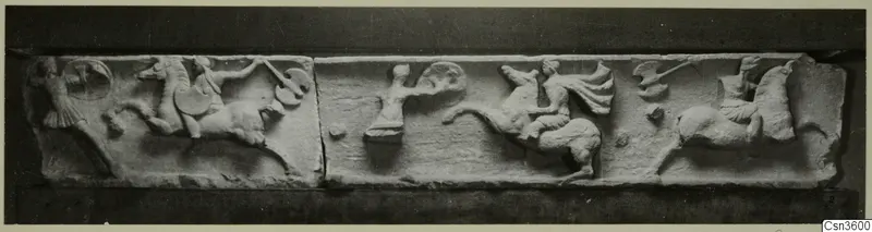 Carved relief frieze in pale stone showing horse riders and a disc, photographed as two slabs