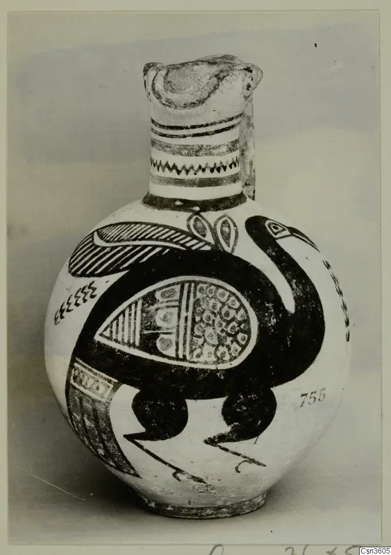Painted jug with a large black bird on a cream ground, with banded and zigzag lines on the neck