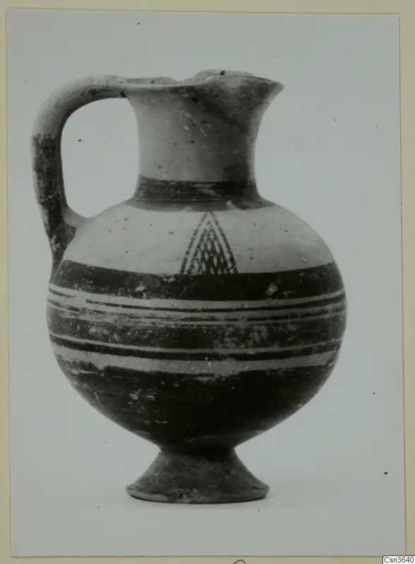 Pottery Bichrome I jug from Lapithos, with a strap handle, banded body and hatched triangle motif