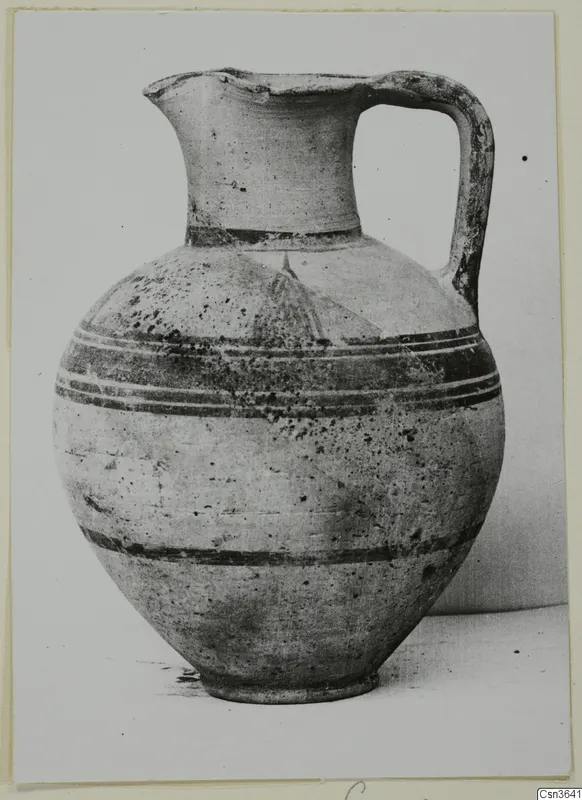 Pottery Bichrome II jug with a strap handle and dark painted bands