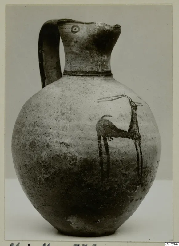Painted pottery jug with a single handle and a dark animal figure on its rounded body