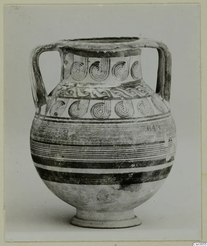 Two-handled painted pottery vessel with spiral motifs and horizontal bands, photographed against a plain background