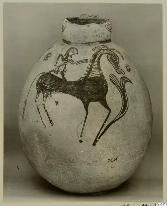 Painted jug with a rider on a long-necked animal in dark paint on a pale ground