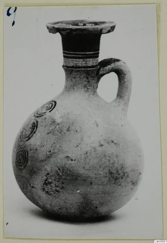Pottery Bichrome IV jug with a single loop handle and concentric circle motifs on the body