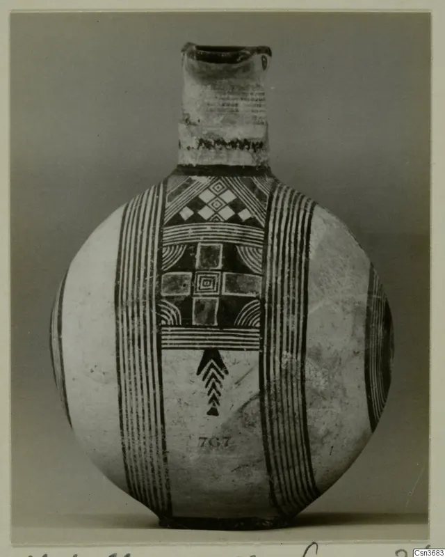 Round-bodied jug with black painted bands and geometric panels