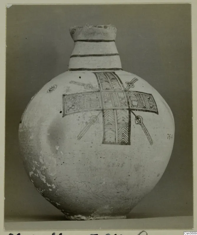 Pottery Bichrome IV jug with banded neck and cross-shaped painted panels on a round body