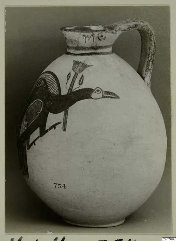 Pottery Bichrome IV jug with a painted bird and flower, number 754 on the body