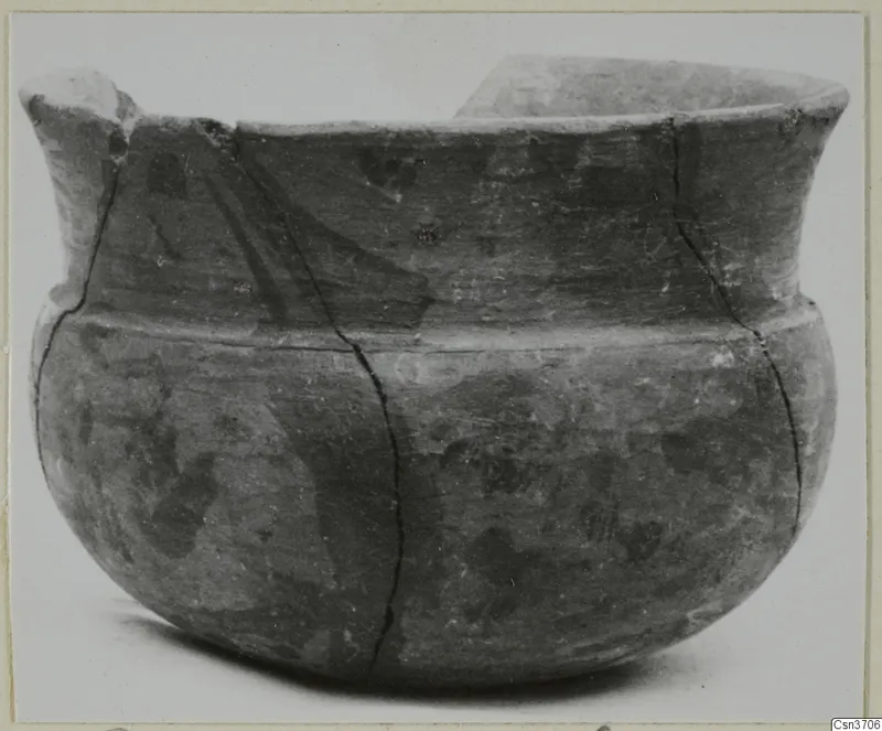 Pottery Stroke Polished Ware bowl from Marion, with a dark burnished surface, a flared rim and a broken lug