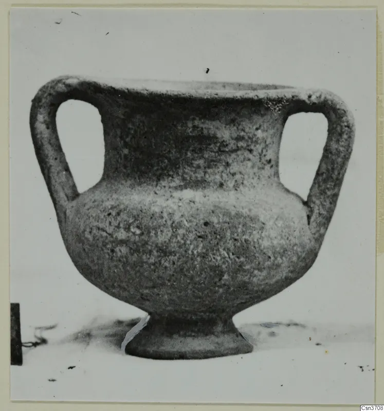 Grey polished ware vessel with two handles and a pedestal foot, from the Lapithos Kastros tombs