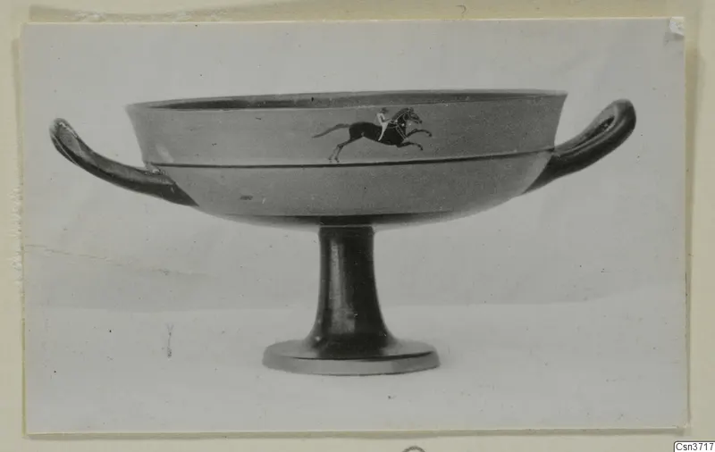 Stemmed bowl with two horizontal handles, its side decorated with a painted horse and rider