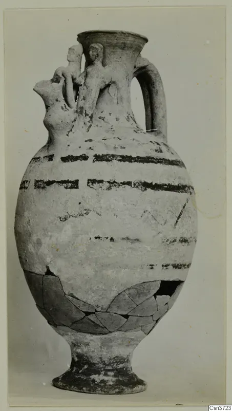 Jug from Marion with two modelled figures at the neck and black painted bands on the body