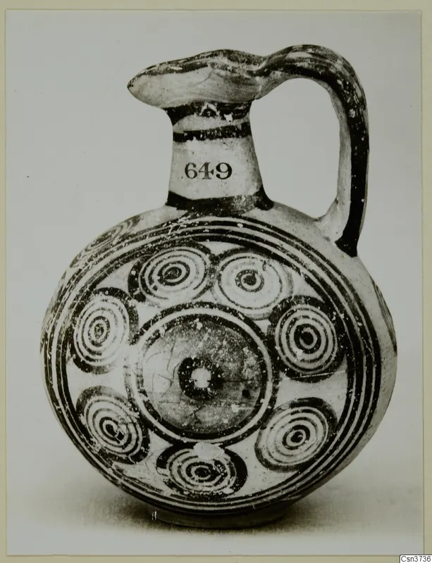 Painted jug with concentric circle motifs on its body and a number label on the neck
