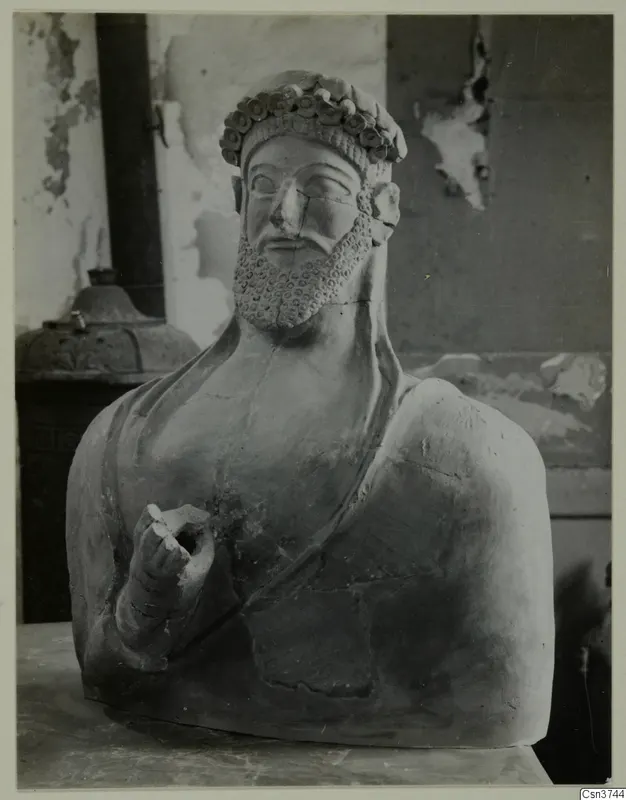 Bust of a bearded figure wearing a wreath, terracotta, from Mersinaki