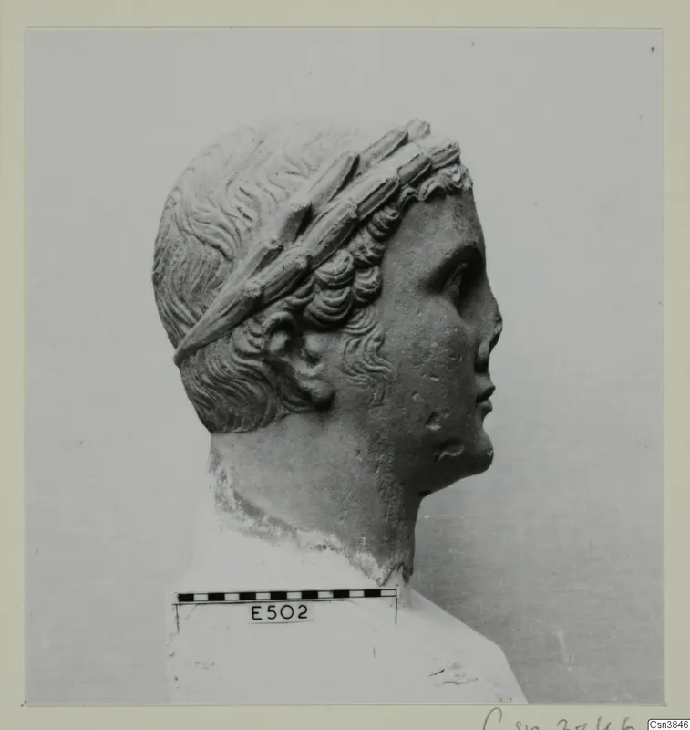 Sculpted head and upper bust in profile, facing right, with a wide band wound through the hair
