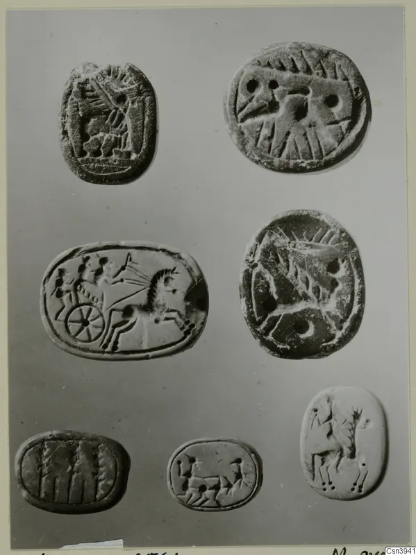 Seven engraved seals or gems, including a chariot with a horse and driver, arranged in rows on a grey background.